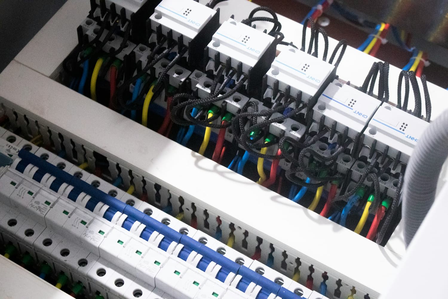 Close up of an electrical panel with colorful wires